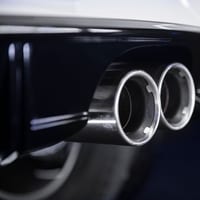 Close-up of a car's dual exhaust muffler tips