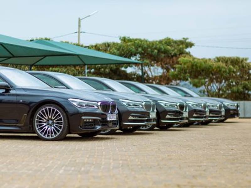 A row of cars parked on a lot